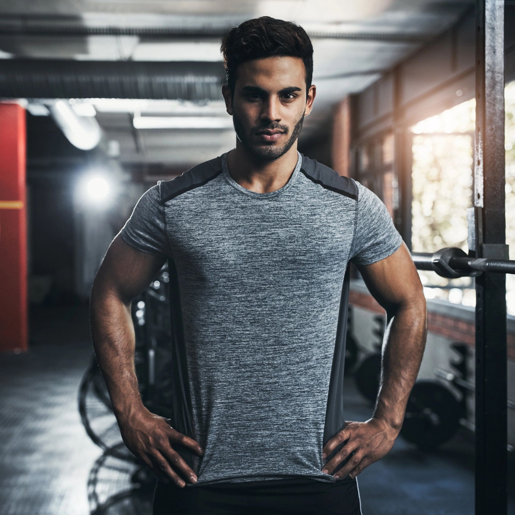 Portrait of a male fitness coach in a gym
