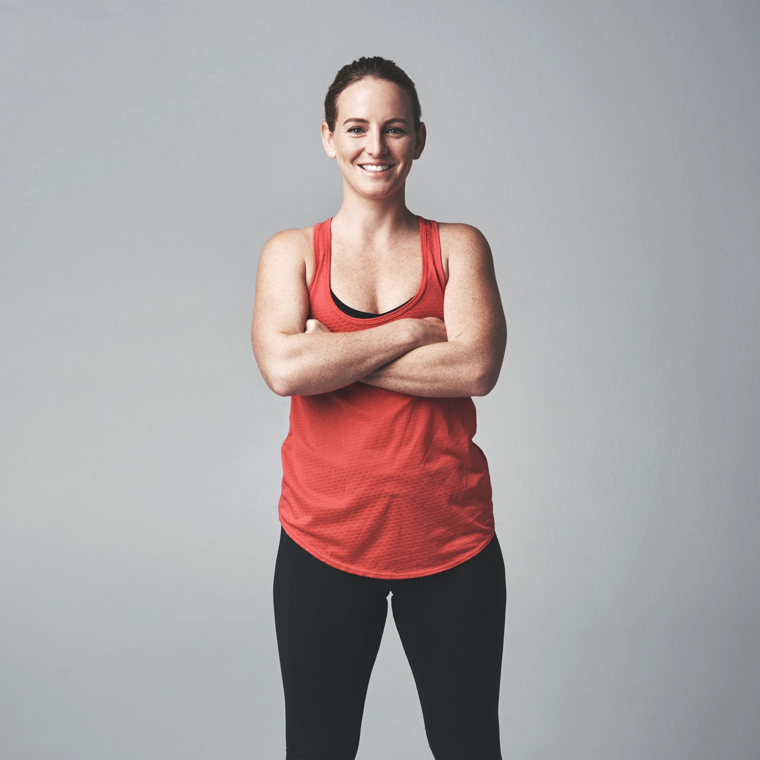 Portrait of a female fitness coach with arms crossed