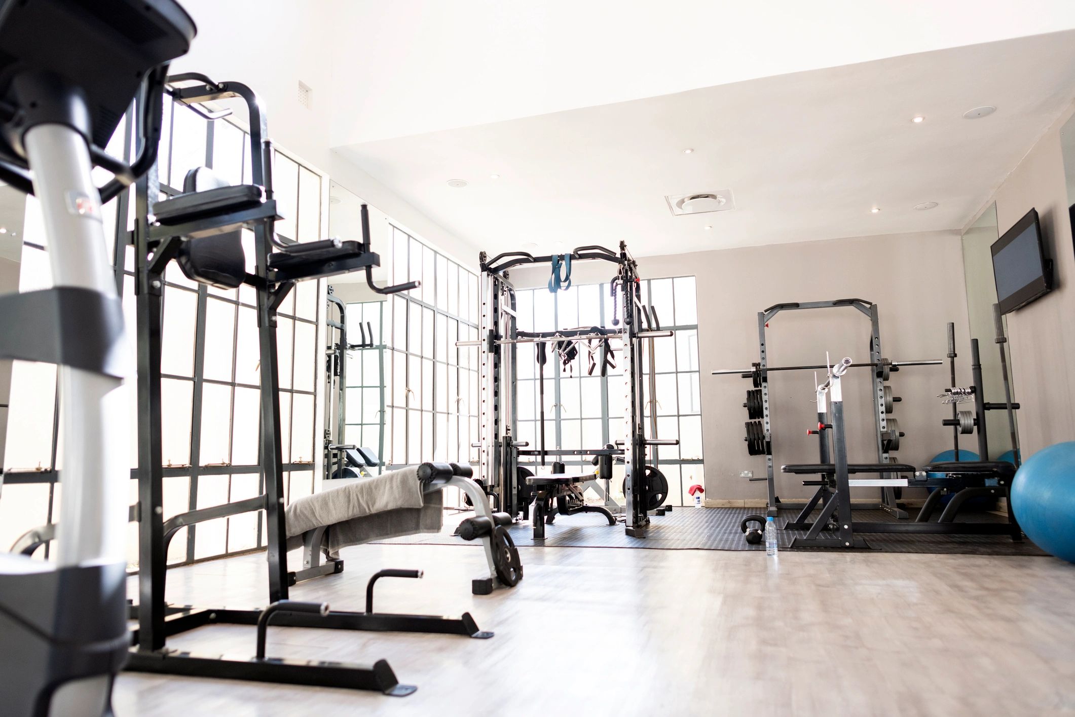Strength training machines in a clean, modern gym