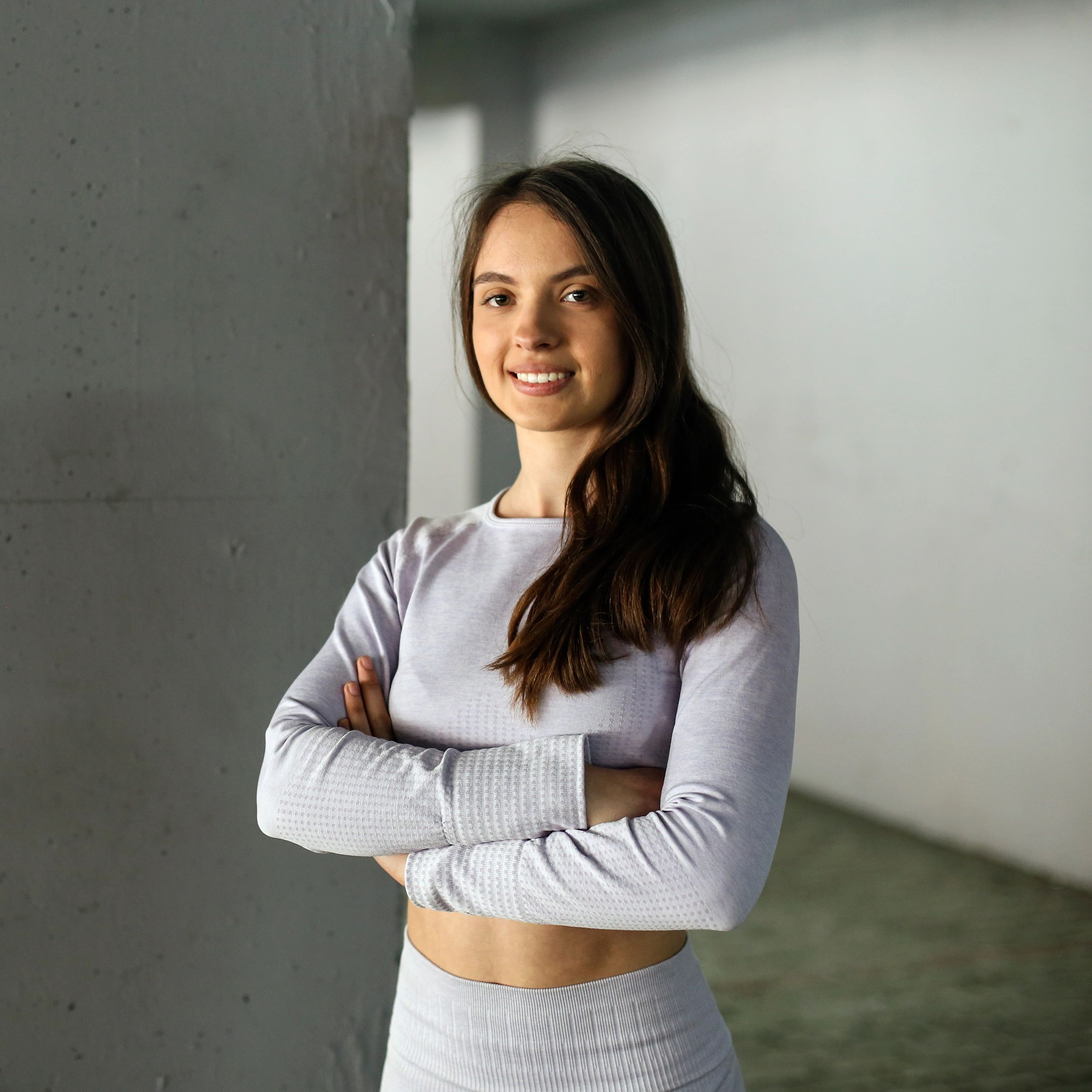 Portrait of a fit young woman smiling after a workout