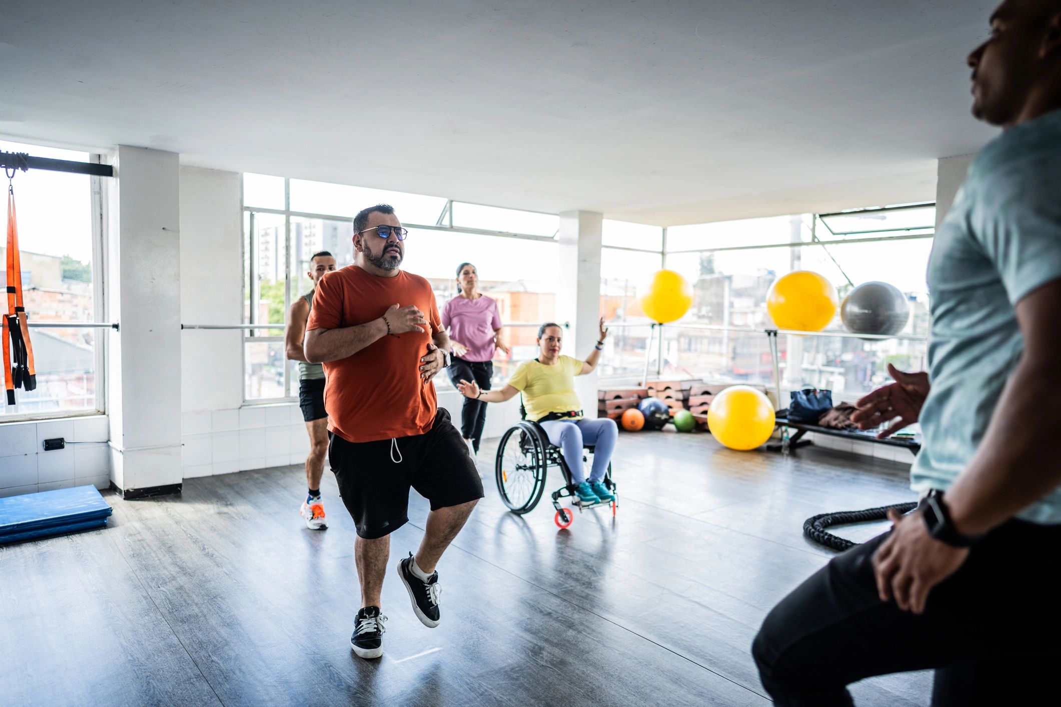 Small group fitness class training together in a gym