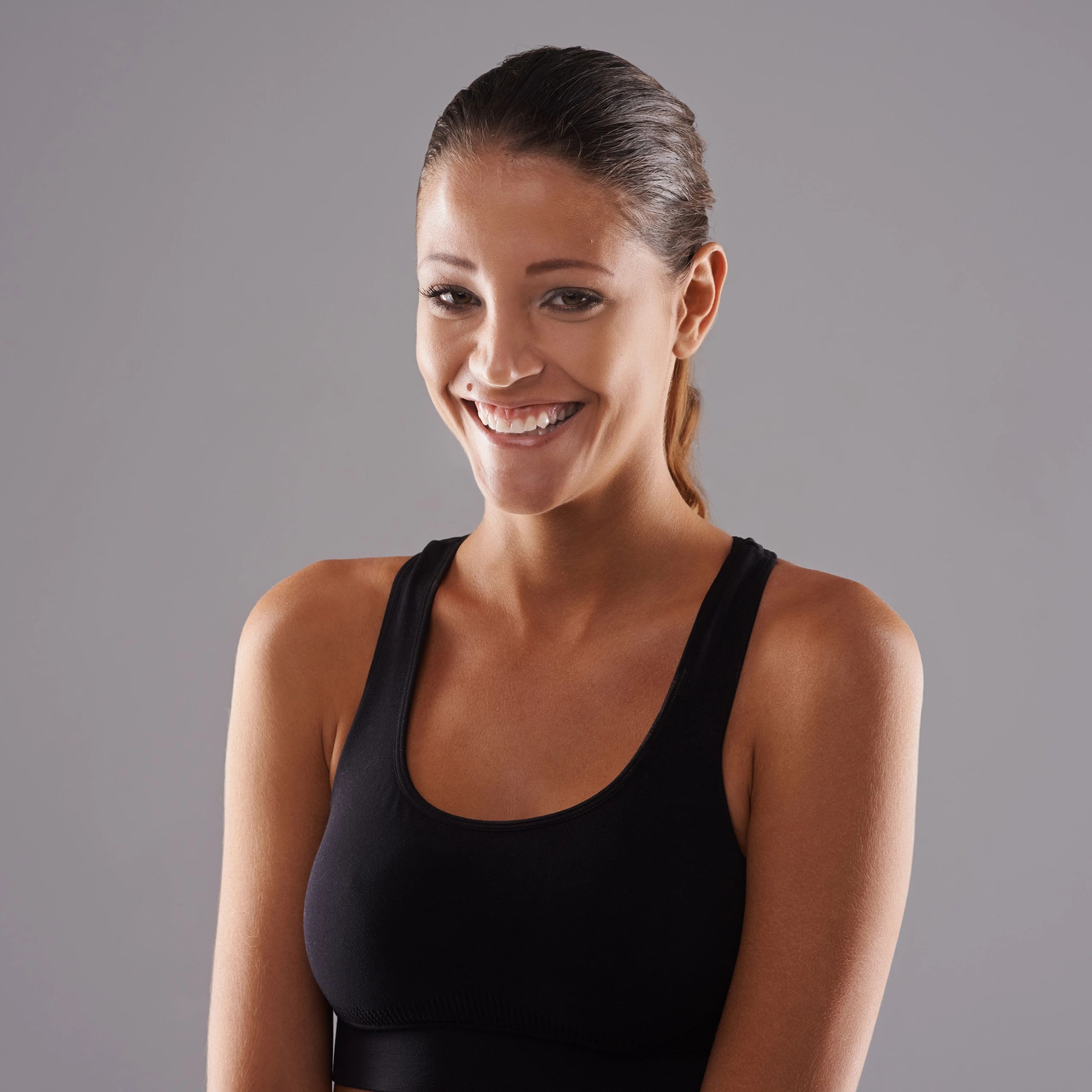 Portrait of a young woman against a neutral background